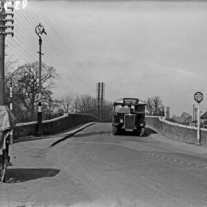 Bus approaching, High Bridge, near the Swan and Bottle, Uxbridge 22 March 1935