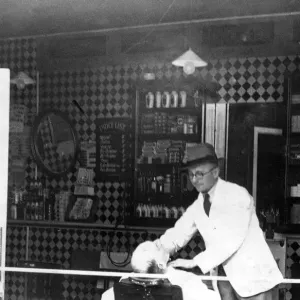 Business as usual - this hairdresser carries on though his windows were blown by a bomb Business as usual - this hairdresser carries on though his windows were blown by a bomb