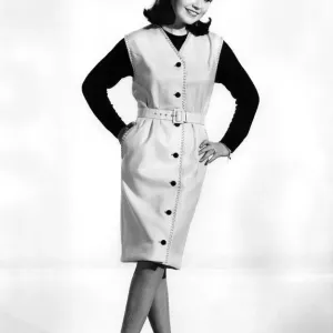 Buttoned suit dress with black jumper underneath. Reveille Fashions: Rosemary Bell Buttoned suit dress with black jumper underneath. Reveille Fashions: Rosemary Bell