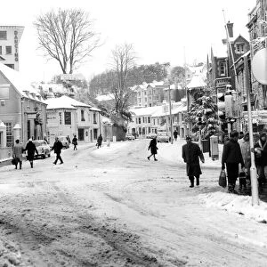 Bygones snow scene - New Road, Brixham at its town centre junction with Fore Street