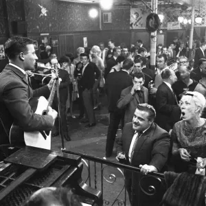 Cabaret singer performing in a East End of London pub on a Saturday night. 6th July 1963 Cabaret singer performing in a East End of London pub on a Saturday night. 6th July 1963