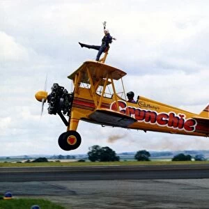 A Cadburys Crunchie Boeing-Stearman Model 75 biplane, with wing walker onboard