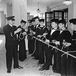 Cadets under instructions by a Senior Officer learning how a bow-line knot is made