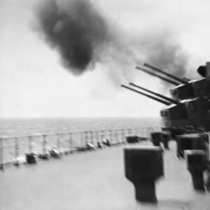 A full calibre firing from the secondary armament of the Royal Navy battleship HMS Duke