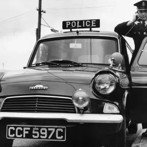 A Cambridgeshire Police Officer in a Ford Anglia Print, 1965