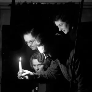 Candlelight in the air raid shelter. September 1940 Candlelight in the air raid shelter. September 1940