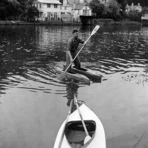 Canoeist Dave Pegram testing his water boots invention on the river