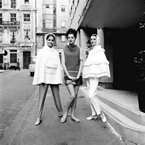 The cape became the item every girl wanted in 1962. These models posed in the street