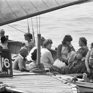 The captain of the Grace Darling has a sandwich whilst waiting to fill his boat with The captain of the Grace Darling has a sandwich whilst waiting to fill his boat with