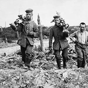 Captured German machine gunners carrying their guns following the Battle of Messines