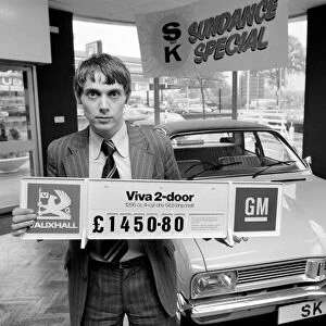 A car dealer putting cars on sale in his garage forecourt in Brighton. May 1975