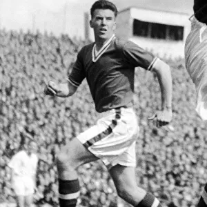 Cardiff City centre half Danny Malloy in action, 27th August 1957
