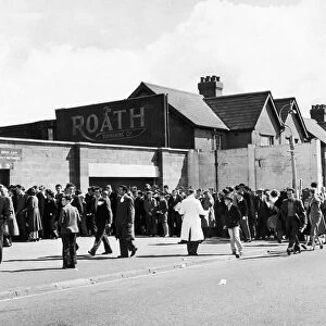 Cardiff City fans queue at the turnstiles for the big game, 26th August 1957