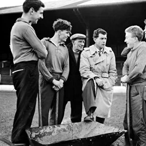 Former Cardiff City player Billy James in later years, chatting to groundstaff at Ninian