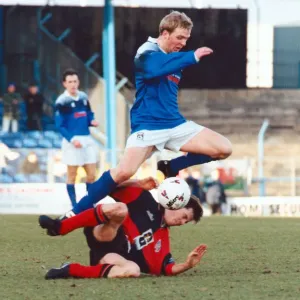 Cardiff City v Colchester United. Gareth Stoker of Cardiff jumps over a Colchester player Cardiff City v Colchester United. Gareth Stoker of Cardiff jumps over a Colchester player