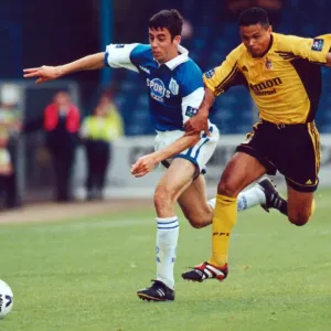 Cardiffs Mark Delaney beats Fulhams John Salako to the ball Cardiffs Mark Delaney beats Fulhams John Salako to the ball