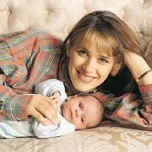 Carol Smillie tv presenter with baby Christie