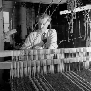 Carpet Making Picture shows a man working on his loom Carpet Making Picture shows a man working on his loom
