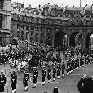 The Carriage Procession of Prime Ministers passes underneath Admiralty Arch as it makes