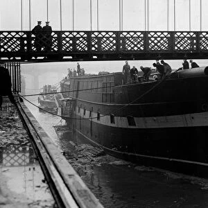 The Carrick last of the wool clippers 1954, slips under suspension bridge on her way to a