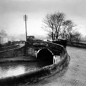 Cars going over a bridge in Maghull, Merseyside. 24th November 1934