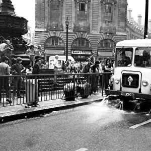 The cart drenching the gutter and splashing the hippies yesterday. August 1969 P004939