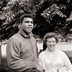 Cassius Clay August 1966 In training, shaking hands with an elderly fan