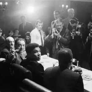 Cassius Clay (centre) at a press conference prior to his rematch with Henry Cooper to Cassius Clay (centre) at a press conference prior to his rematch with Henry Cooper to