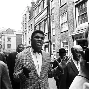 Cassius Clay later to become Muhammad Ali (centre) In town for the heavyweight title