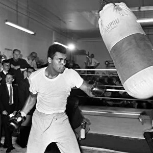 Cassius Clay later to become Muhammad Ali training for his upcoming fight with Brain
