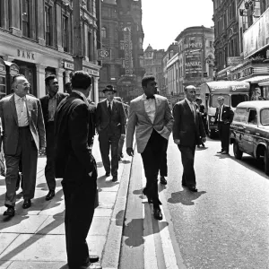 Cassius Clay (Muhammad Ali) (centre) in London England ahead of his next fight