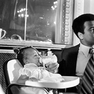Cassius Clay. Muhammad Ali and daughter Hannah. Ali has baby sitter problems