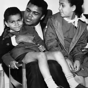 Print of Cassius Clay with young fans in Glasgow Print of Cassius Clay with young fans in Glasgow