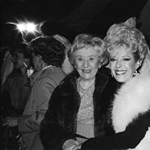 The cast of Coronation Street attend a party. Doris Speed and Julie Goodyear