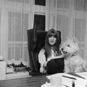 Cathy McGowan, English Television Personality, pictured in her office with her dog Cathy McGowan, English Television Personality, pictured in her office with her dog
