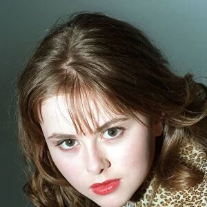 Catriona Evans looking sultry wearing leopard design silk blouse light brown shoulder