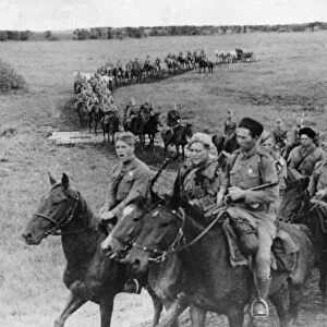 Cavalry soldiers of the Soviet Red Army press forward during the battle against