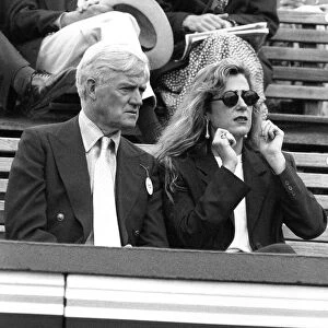 Cecil Parkinson Conservative MP with unknown woman watching Tennis at the Queens Club