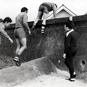 CELTIC FC SEAMILL PLAYERS CLIMBING OVER THE WALL JOCK STEIN Circa