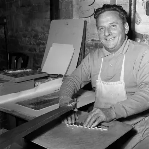 Chad Valley Toy company, Birmingham, West Midlands. Pictured cutting jigsaw puzzles is Mr