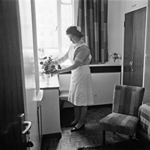 A Chambermaid at The Savoy Hotel in London, pictured in her luxury live in quarters