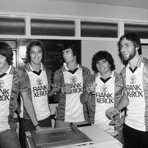 A champagne toast for Southampton FC players wearing their new Rank Xerox sponsored A champagne toast for Southampton FC players wearing their new Rank Xerox sponsored