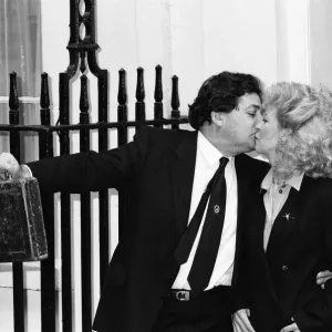 Print of Nigel Lawson and his wife Therese leaving Downing Street