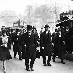 Chancellor of the Exchequer Winston Churchill carrying his dispatch case on his way to