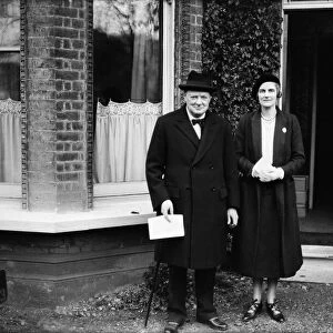 Chancellor of the Exchequer Winston Churchill poses with his wife Clementine