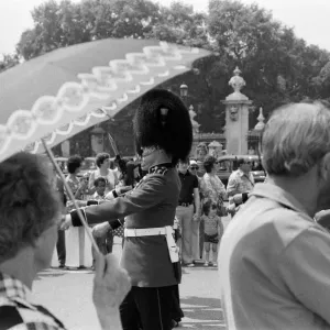 Changing of the Guard in London today. The Guards begin to wilt at the knees in the hot Changing of the Guard in London today. The Guards begin to wilt at the knees in the hot