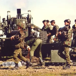 Charges and shells are brought to the guns of the Royal Artillery