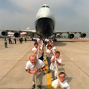 Charity Aircraft Pull. A British Airways Boeing 747 Jumbo Jet is pulled along the tarmac