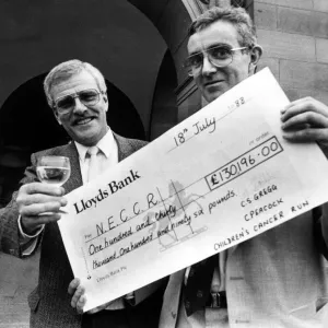 Charity Fun Runners Hand Over £130,000 Cheque Print Charity Fun Runners Hand Over £130,000 Cheque Print