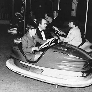 Charles in Dodgem car with David Monk, public relations officer for Betram Mills